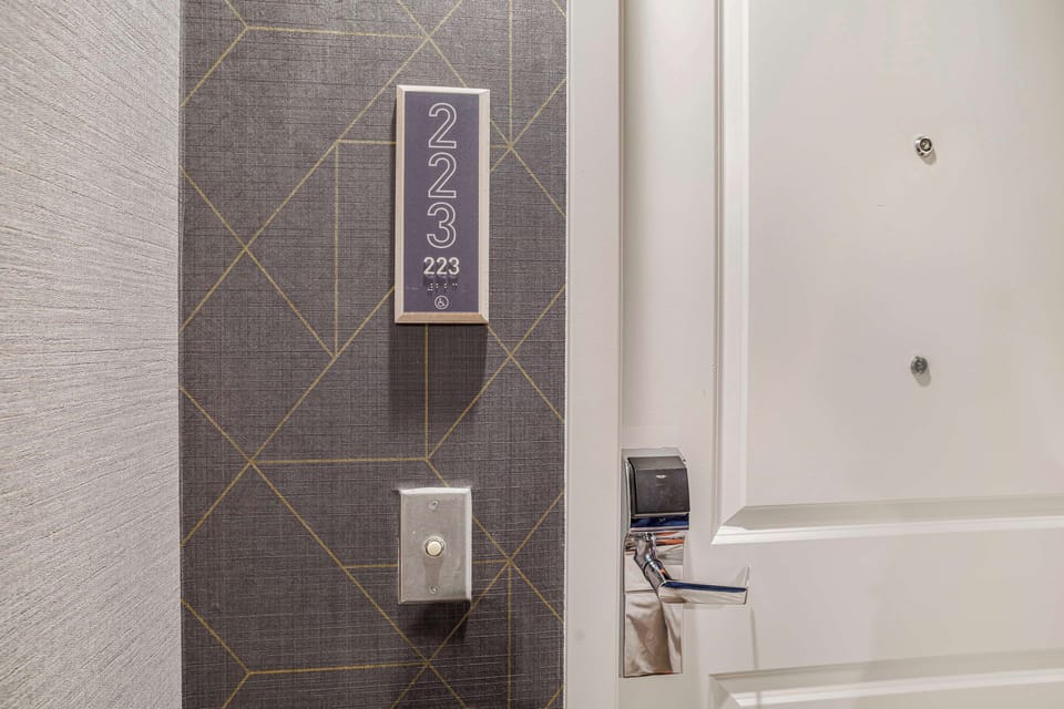 Hypo-allergenic bedding, laptop workspace, blackout drapes