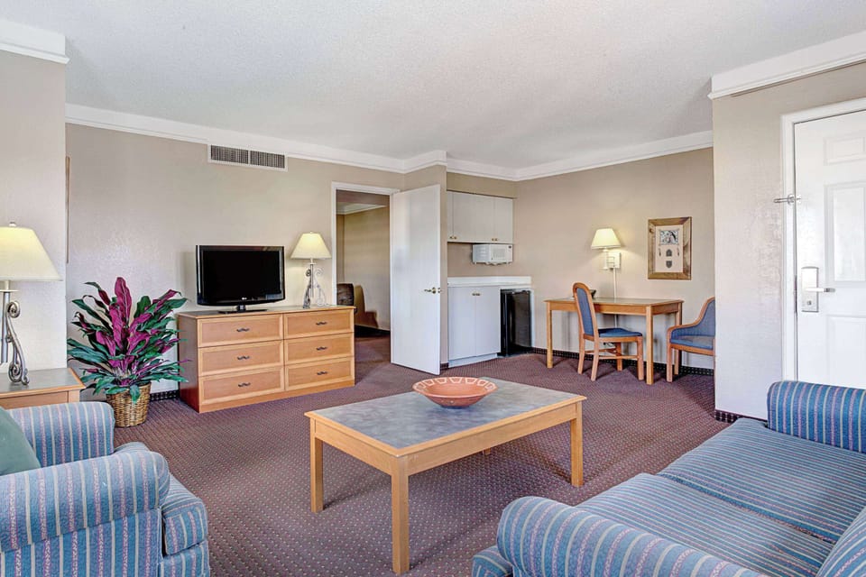 Suite, 2 Queen Beds, Non Smoking | Desk, laptop workspace, blackout drapes, iron/ironing board