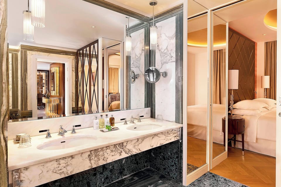 Grand Suite, 1 Bedroom | Bathroom | Combined shower/tub, eco-friendly toiletries, hair dryer, bathrobes