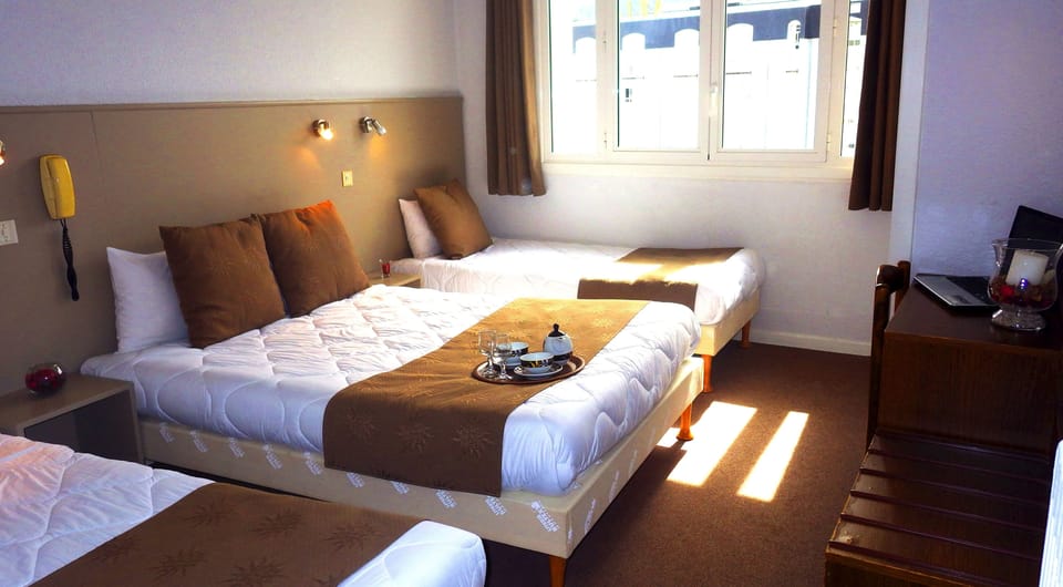 Quadruple Room | Premium bedding, in-room safe, desk, blackout drapes