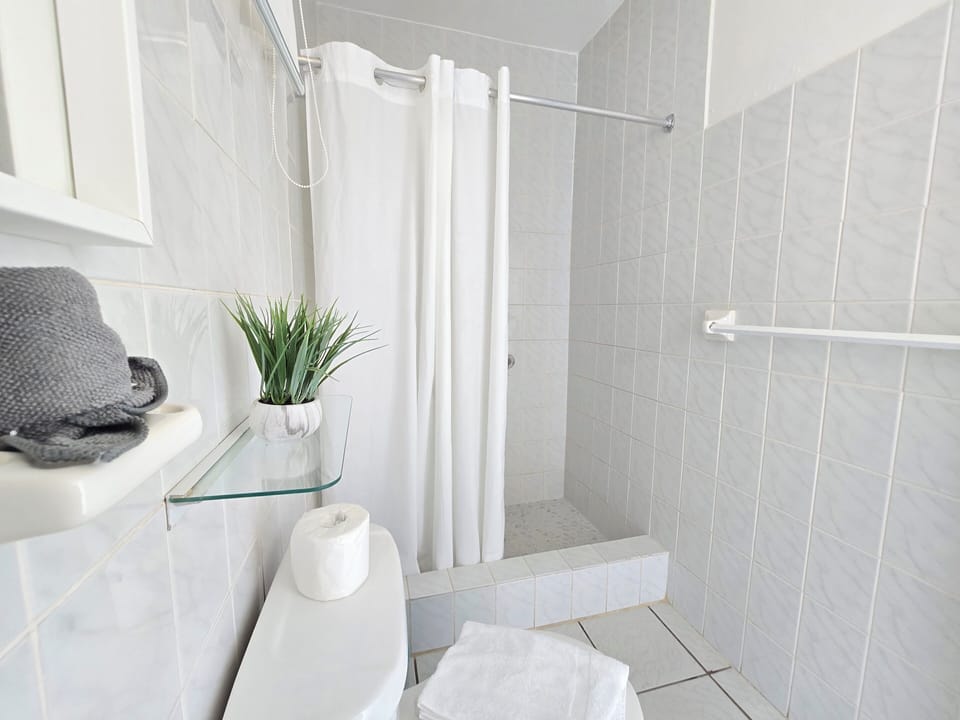 Standard room, 2 double beds with balcony | Bathroom | Shower, hair dryer, towels