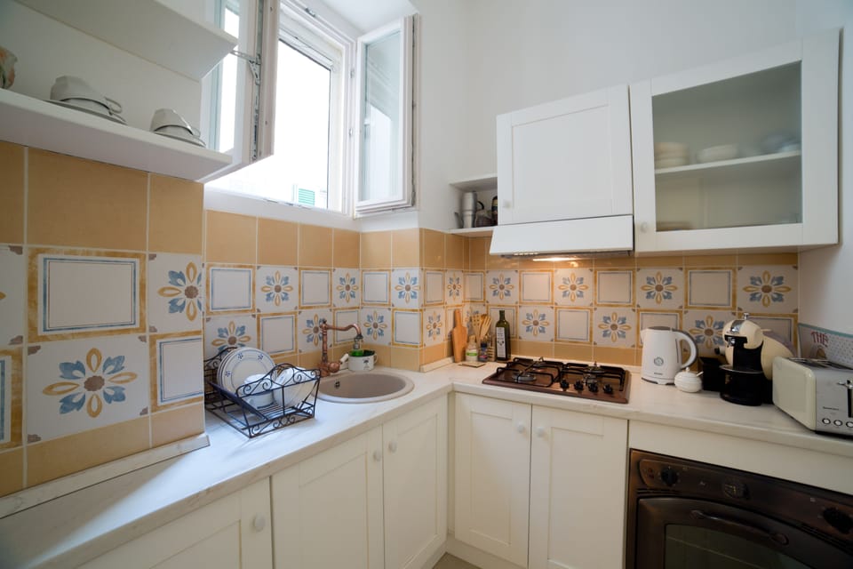 Superior Apartment | Private kitchen | Shared fridge, electric kettle, cookware/dishes/utensils, dining tables