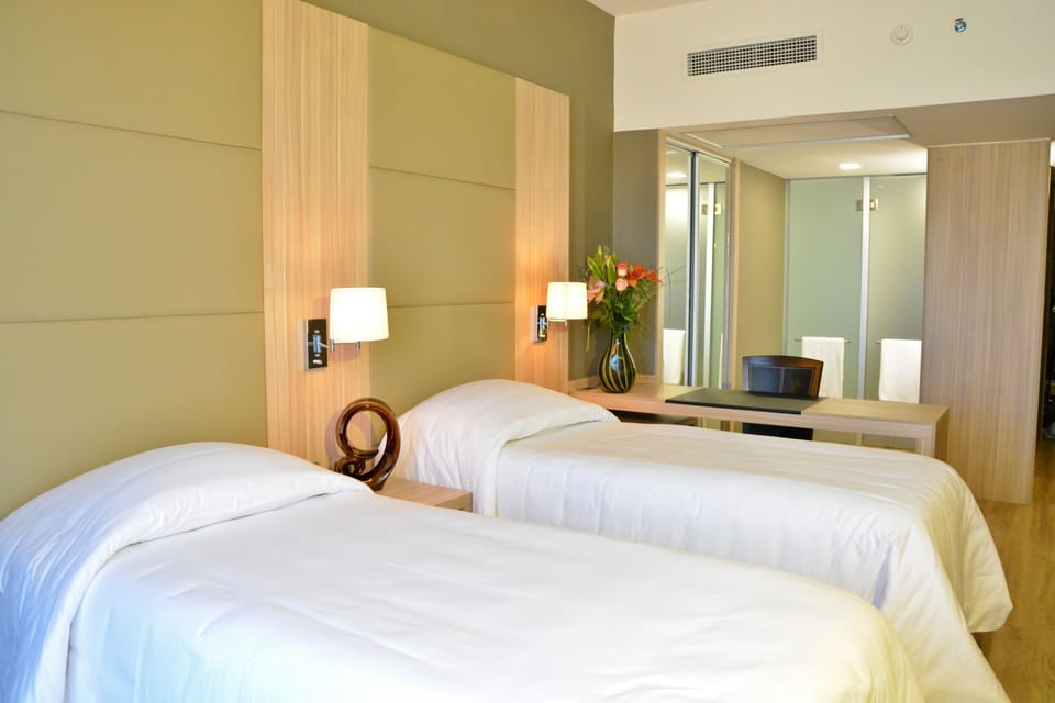 Standard Twin Room, Non Smoking | Minibar, in-room safe, desk, blackout drapes