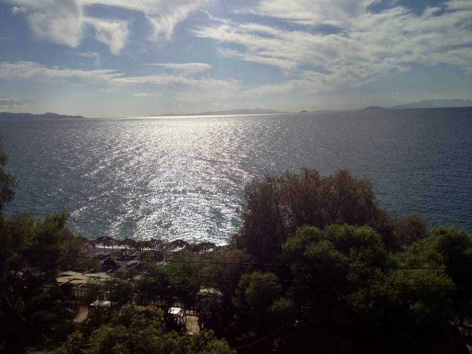 On the beach, white sand, sun loungers, beach umbrellas