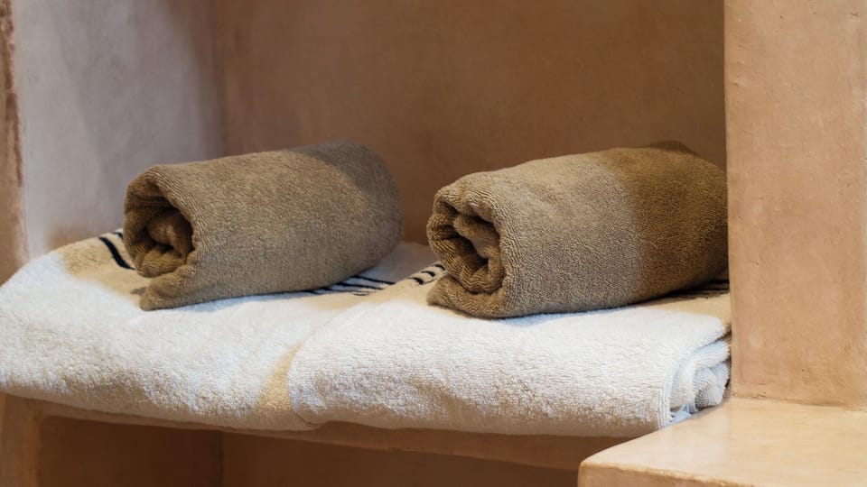 Shower, hair dryer, bathrobes, towels