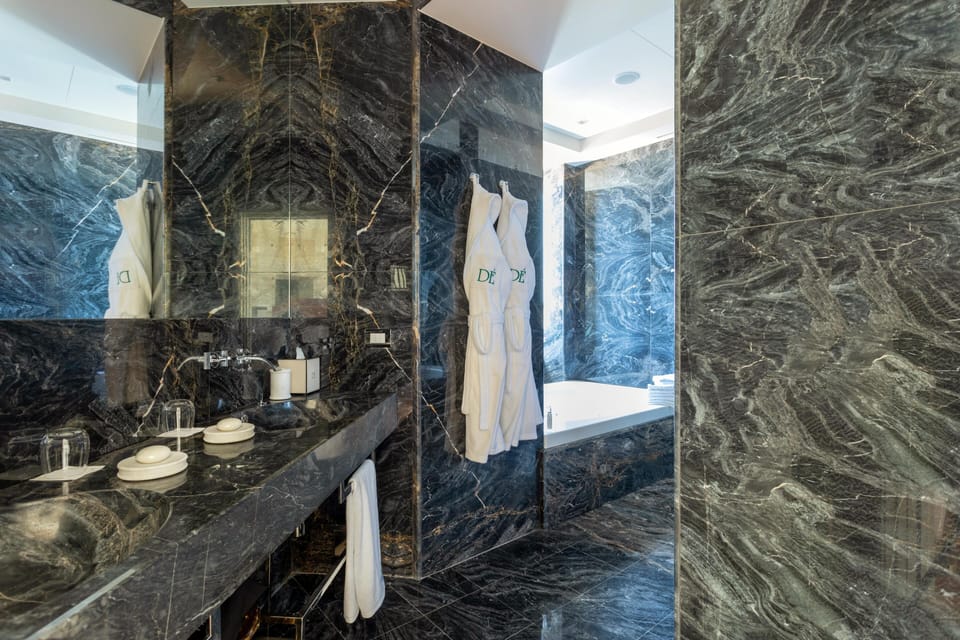 Designer toiletries, hair dryer, bathrobes, slippers