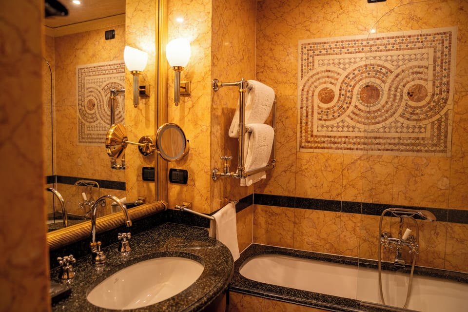 Designer toiletries, hair dryer, bidet, towels