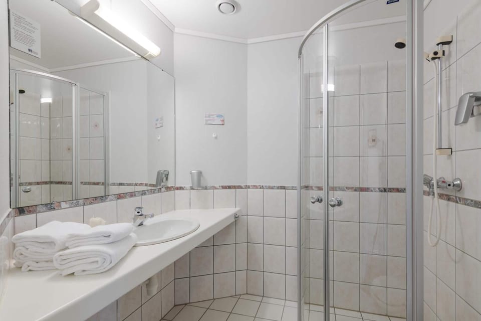 Eco-friendly toiletries, hair dryer, heated floors, towels