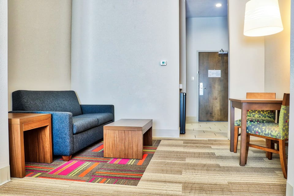 Suite, 1 King Bed (Additional Living Area) | In-room safe, desk, iron/ironing board, free cribs/infant beds