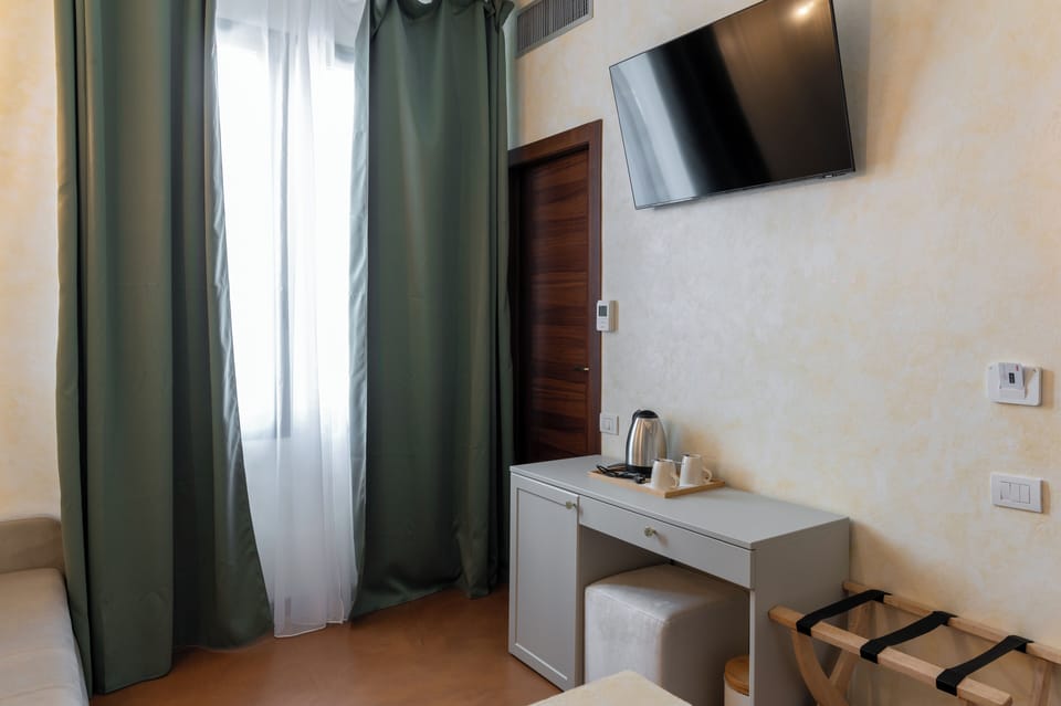 Deluxe Triple Room | Living area | 72-inch TV with digital channels