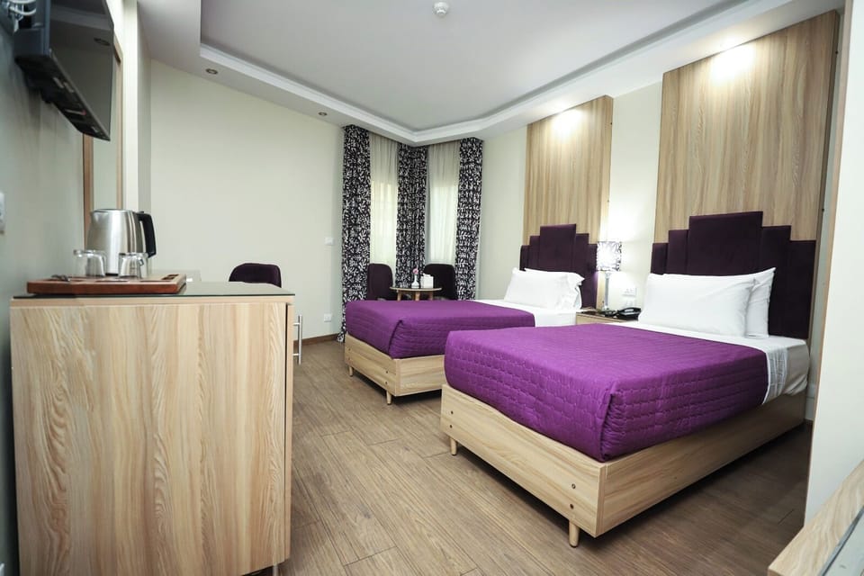 Twin Room | 1 bedroom, minibar, in-room safe, blackout drapes
