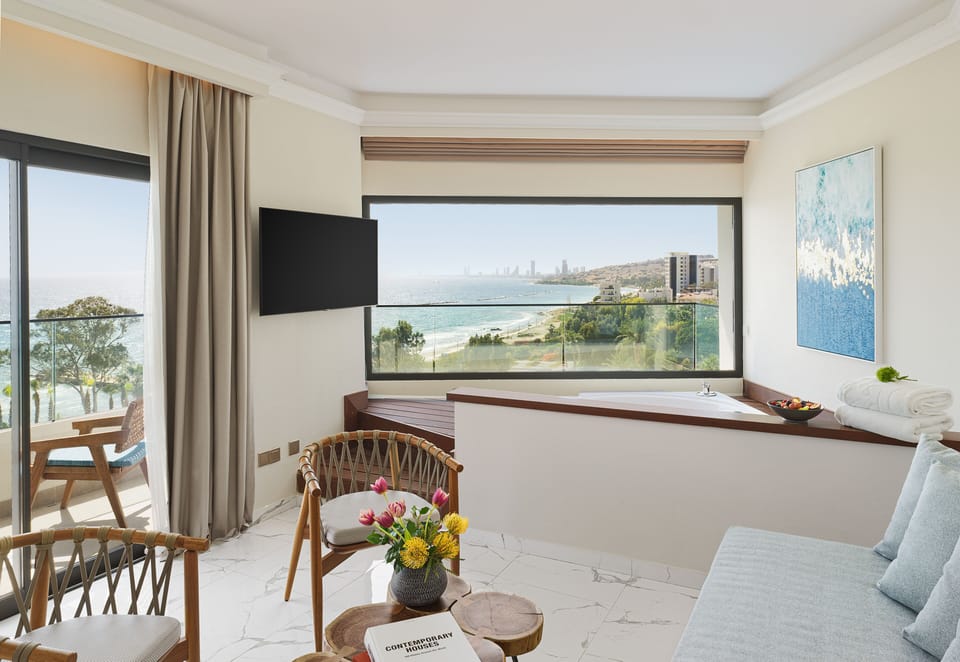 Signature Sea view Suite With Hot Tub | Living area | 40-inch flat-screen TV with satellite channels, TV