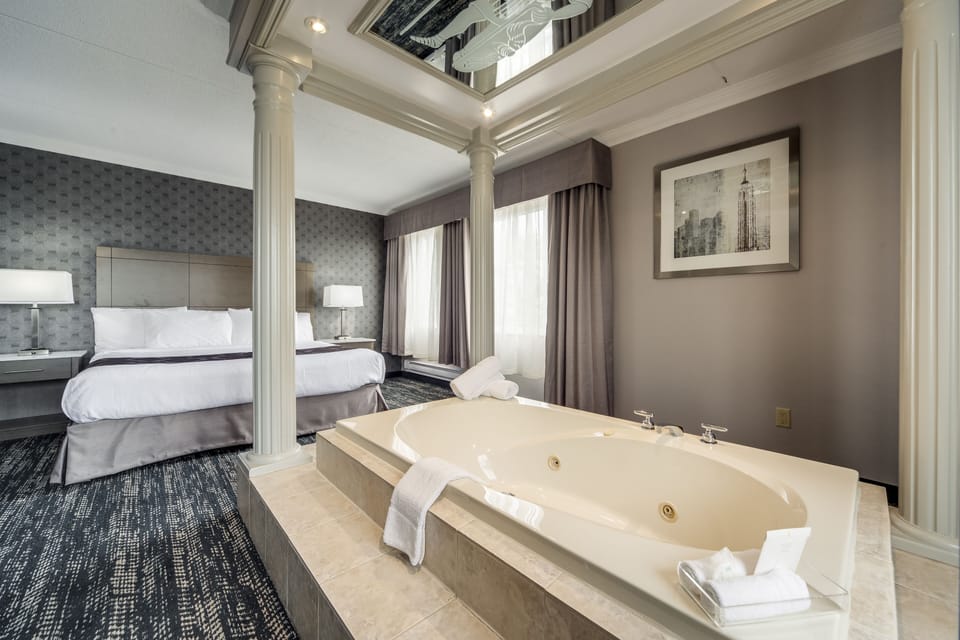 Luxury King Suite with Jetted Tub | Premium bedding, in-room safe, desk, blackout drapes