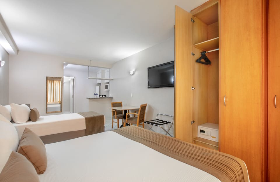Deluxe Triple Room | Hypo-allergenic bedding available, minibar, in-room safe, desk