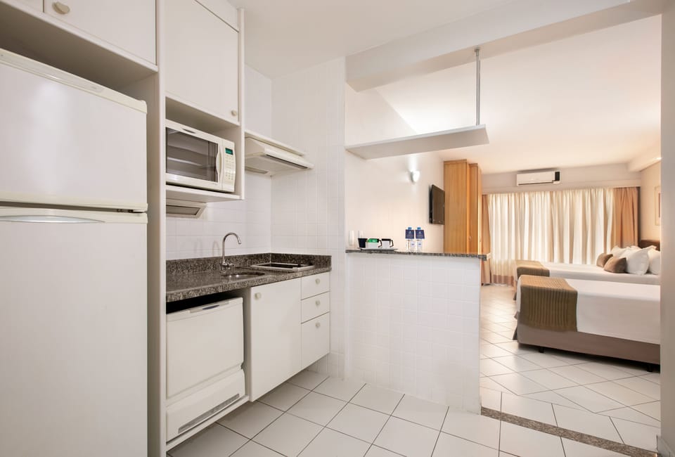 Fridge, microwave, stovetop, cookware/dishes/utensils