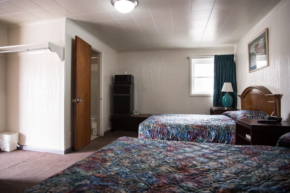 Room, 2 Queen Beds | Iron/ironing board, free WiFi, bed sheets