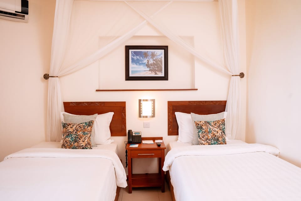 Standard Twin | Premium bedding, minibar, in-room safe, individually furnished