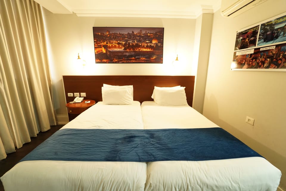 Classic Double or Twin Room | Minibar, in-room safe, desk, iron/ironing board