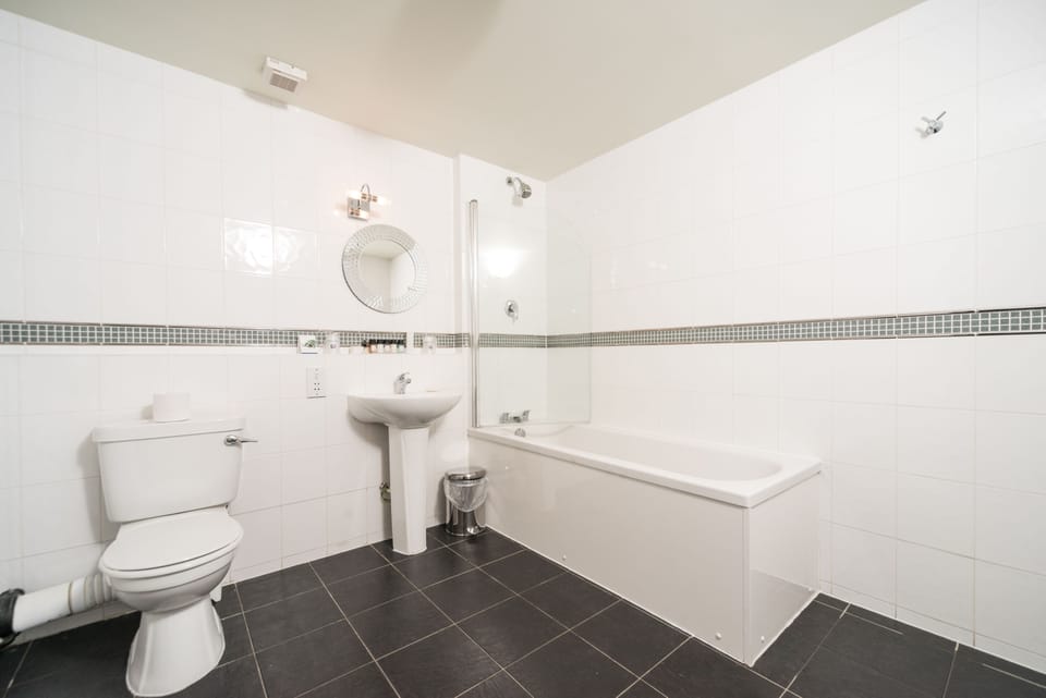 Designer toiletries, hair dryer, towels