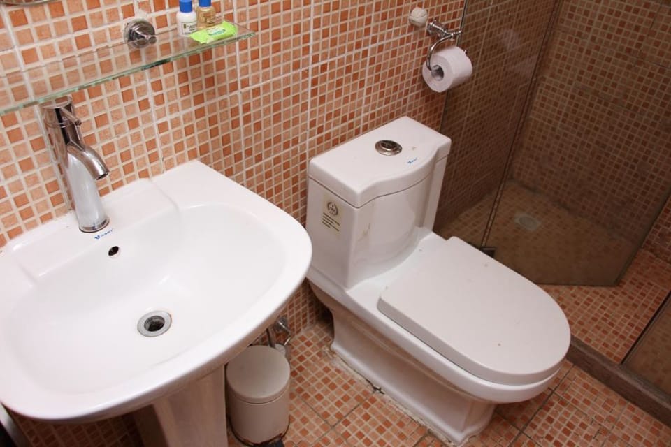 Shower, rainfall showerhead, hair dryer, towels