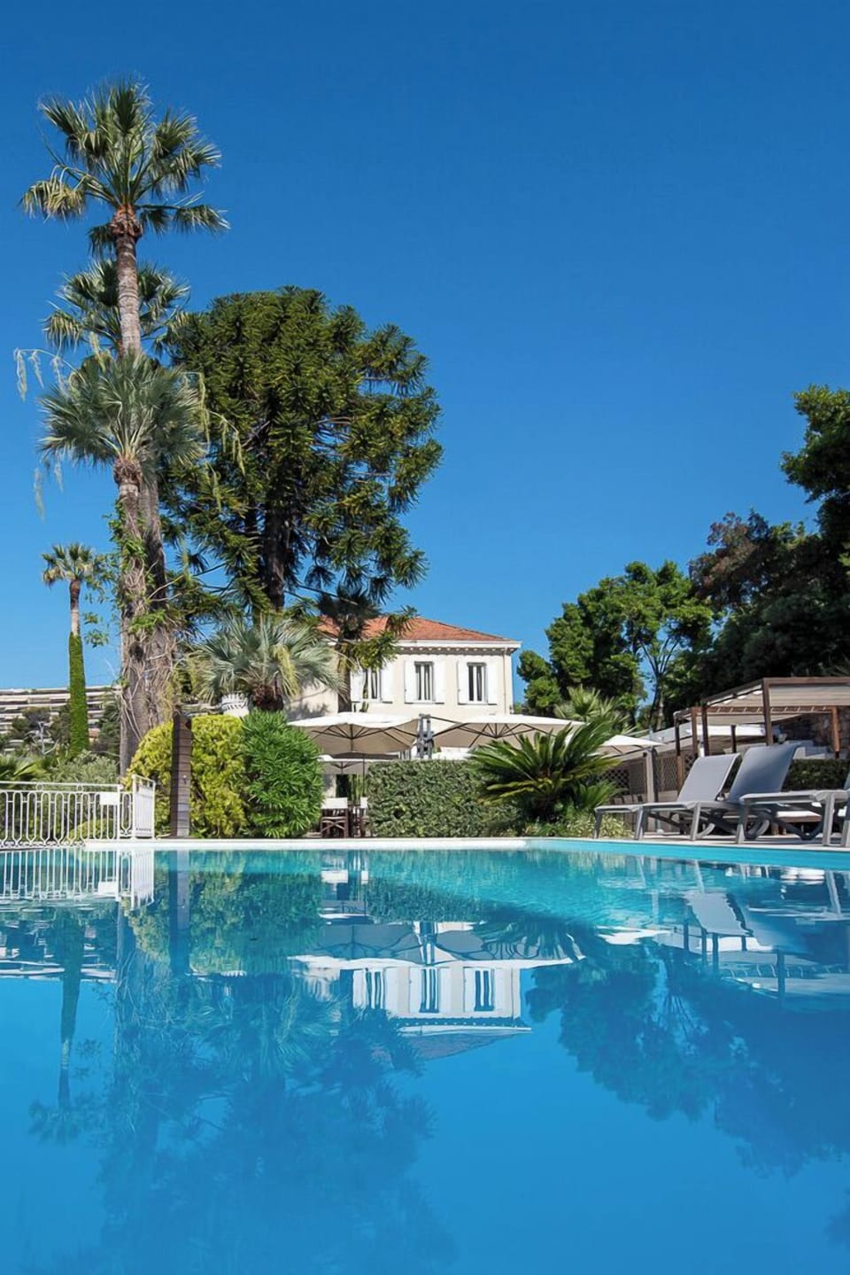 Seasonal outdoor pool, open 9:00 AM to 8:00 PM, pool umbrellas