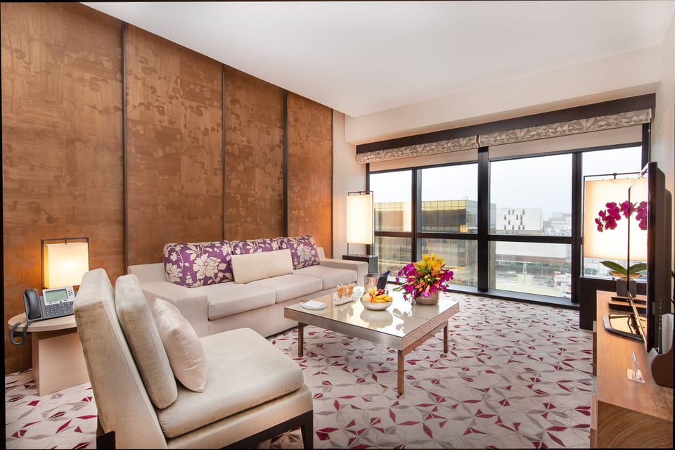 Nobu Suite Room | Living area | 65-inch Smart TV with cable channels, MP3 dock