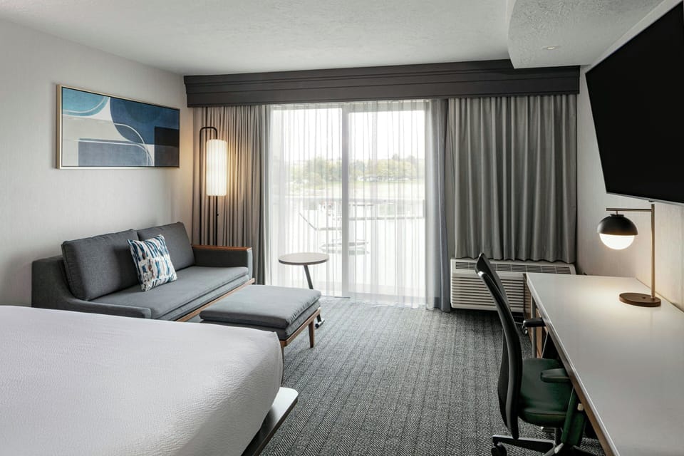 Premium bedding, desk, laptop workspace, iron/ironing board