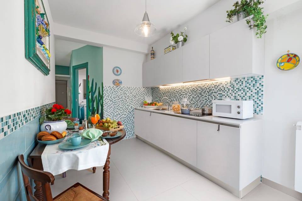 Apartment, 1 Bedroom, Balcony | Private kitchen | Microwave, coffee/tea maker, electric kettle, cookware/dishes/utensils