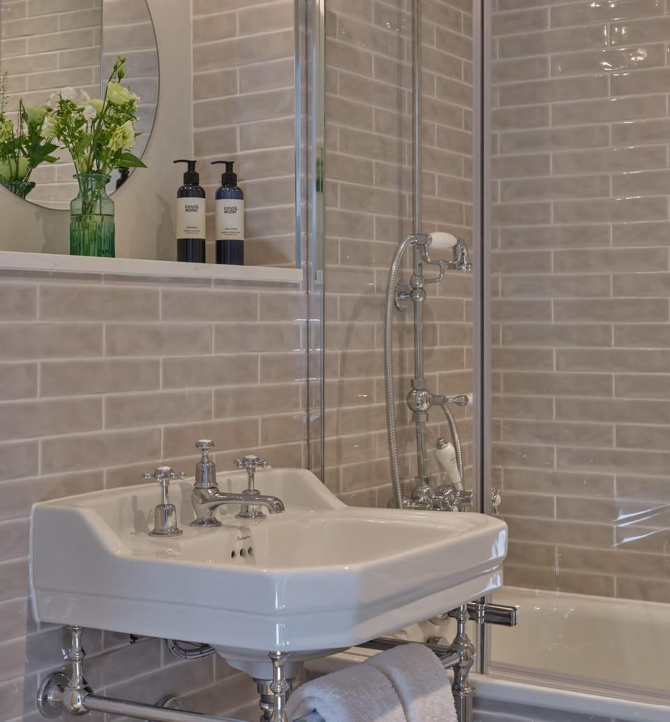 Designer toiletries, hair dryer, towels, soap