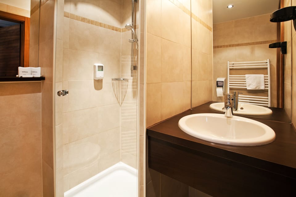 Shower, free toiletries, hair dryer, towels