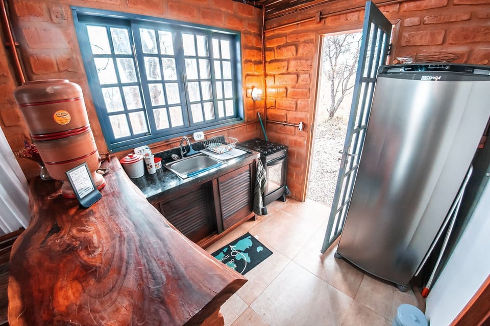 Bungalow | Private kitchen | Full-size fridge, oven, blender, griddle