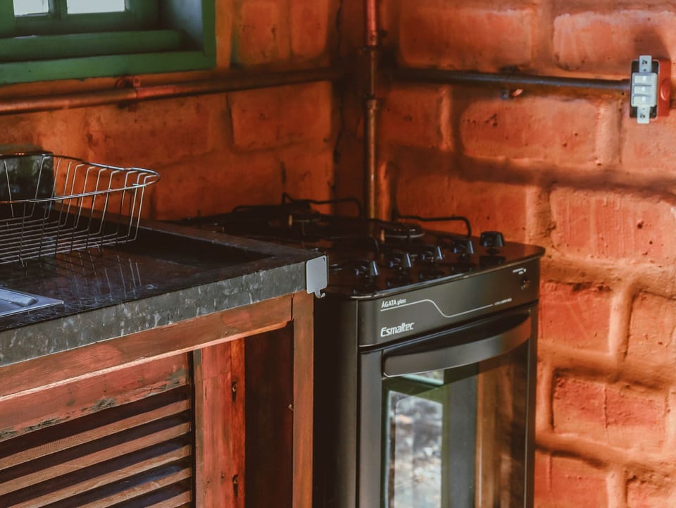 Bungalow | Private kitchen | Full-size fridge, oven, blender, griddle