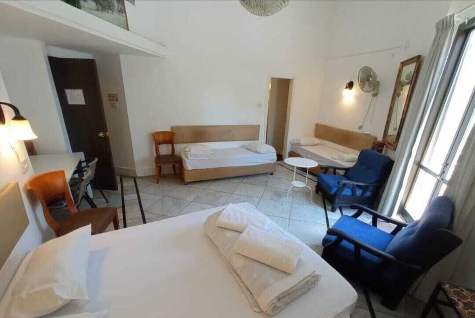Deluxe Quadruple Room, City View | In-room safe, free WiFi, bed sheets