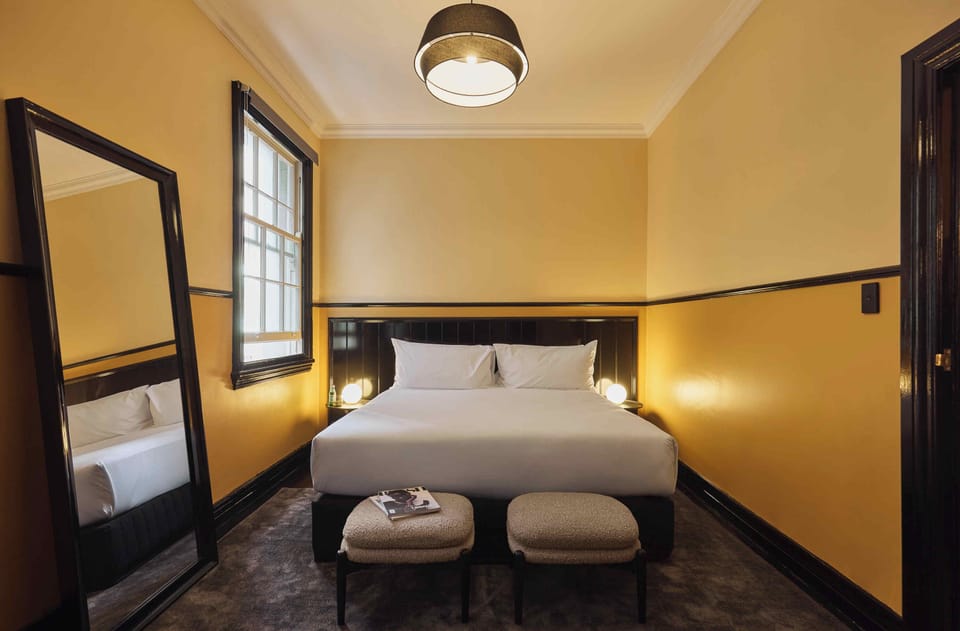 Premium bedding, pillowtop beds, laptop workspace, blackout drapes