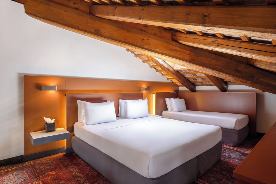 Premium bedding, down comforters, minibar, in-room safe