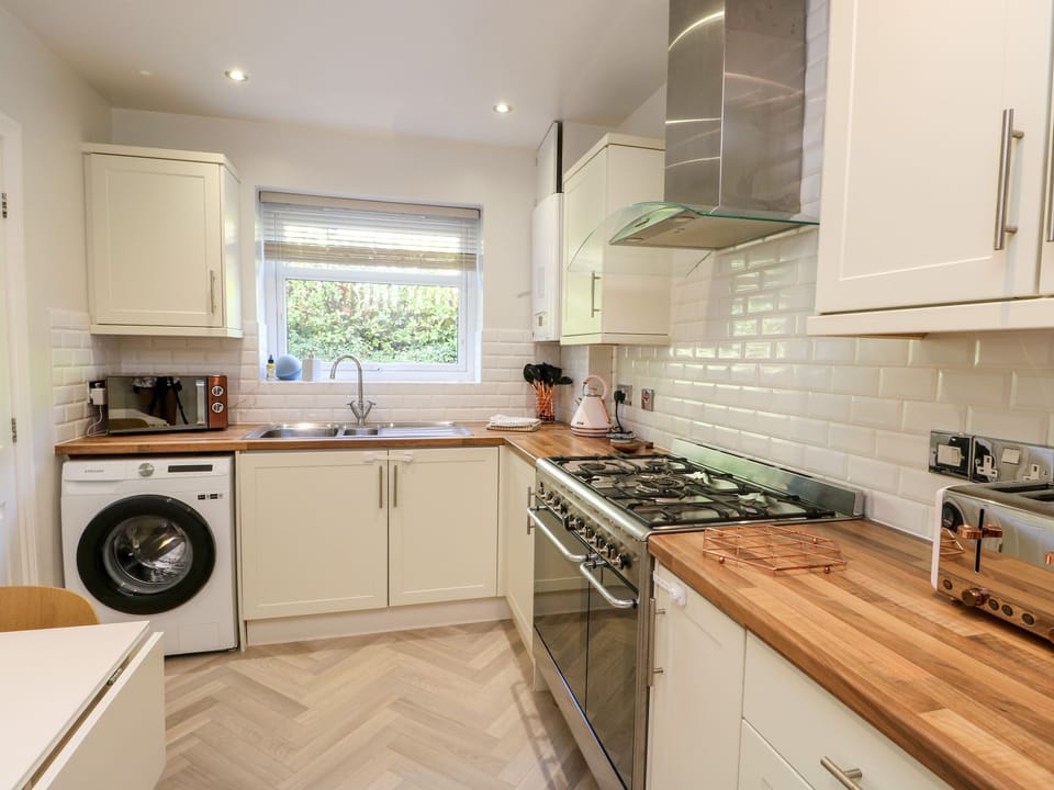 Fridge, electric kettle, toaster, cookware/dishes/utensils