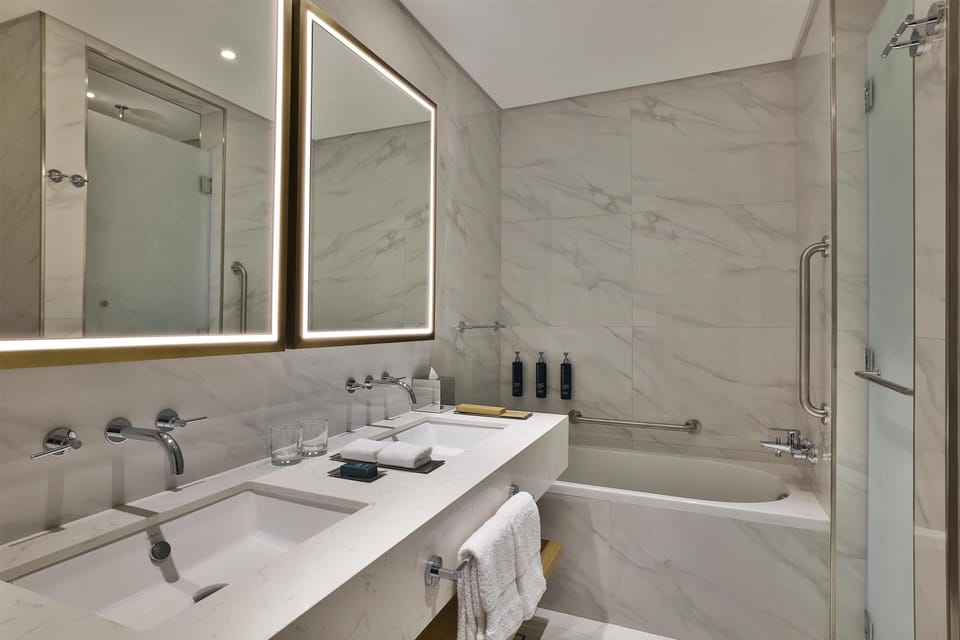 Combined shower/tub, rainfall showerhead, hair dryer, bathrobes