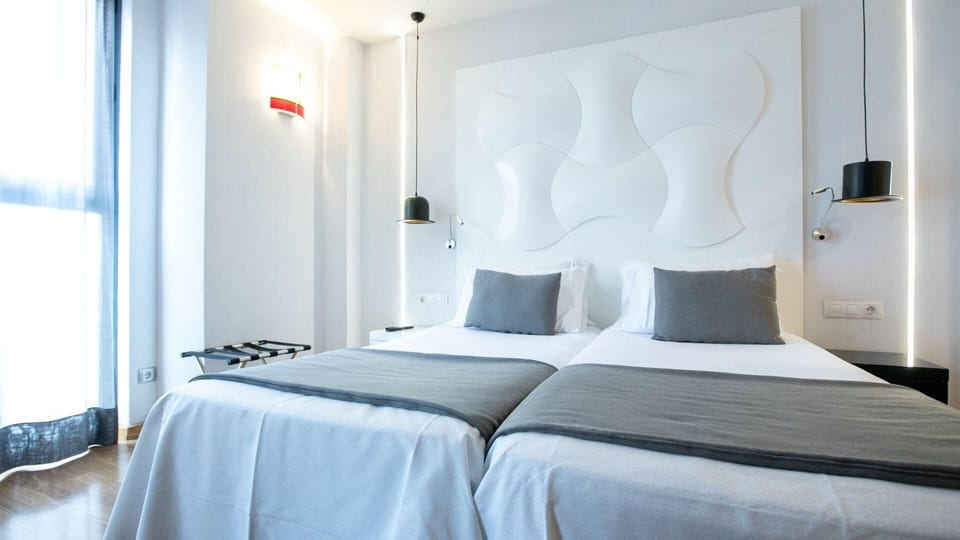 Standard Double Room | Minibar, in-room safe, desk, blackout drapes