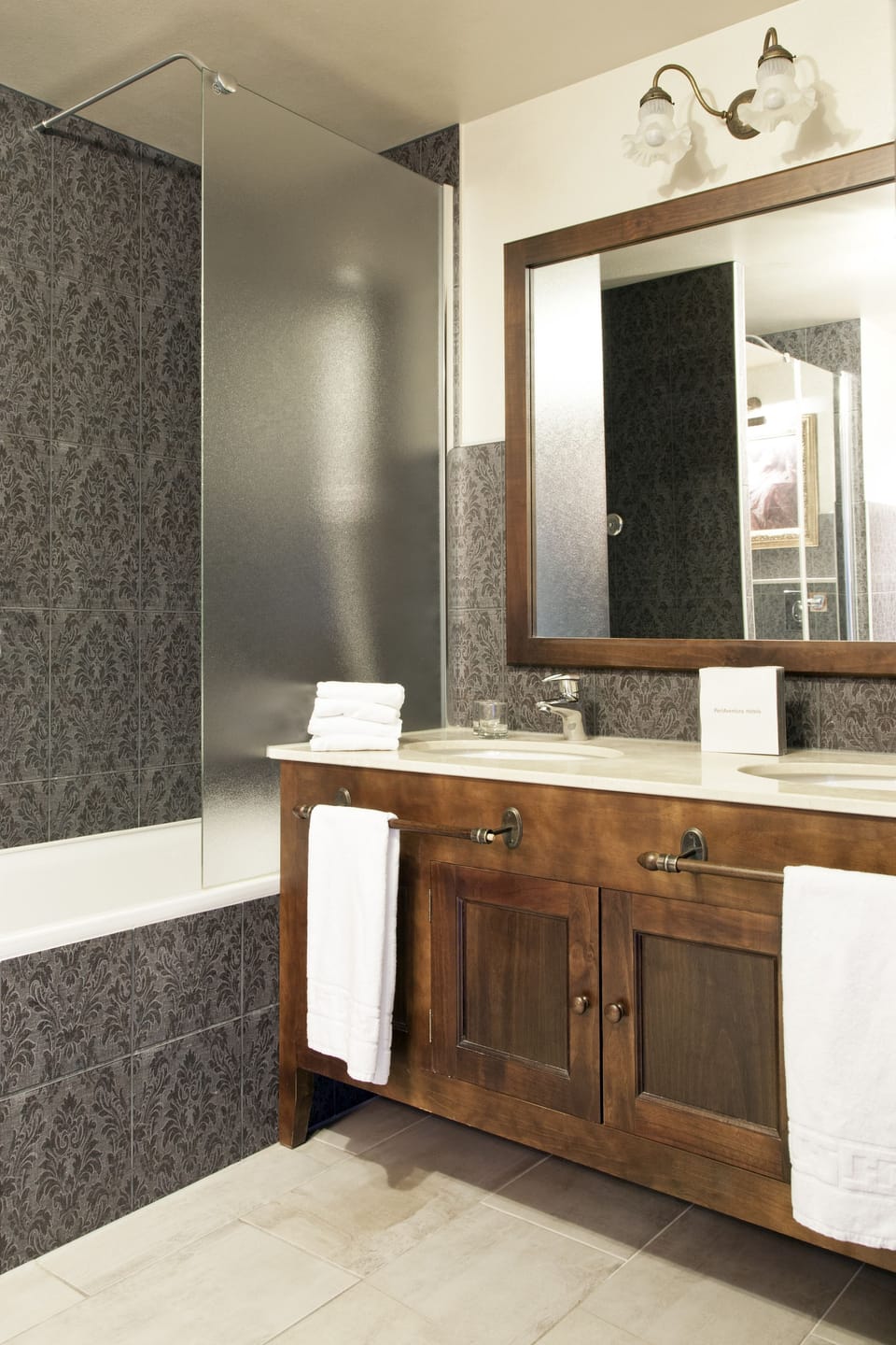 Separate tub and shower, designer toiletries, hair dryer, bathrobes