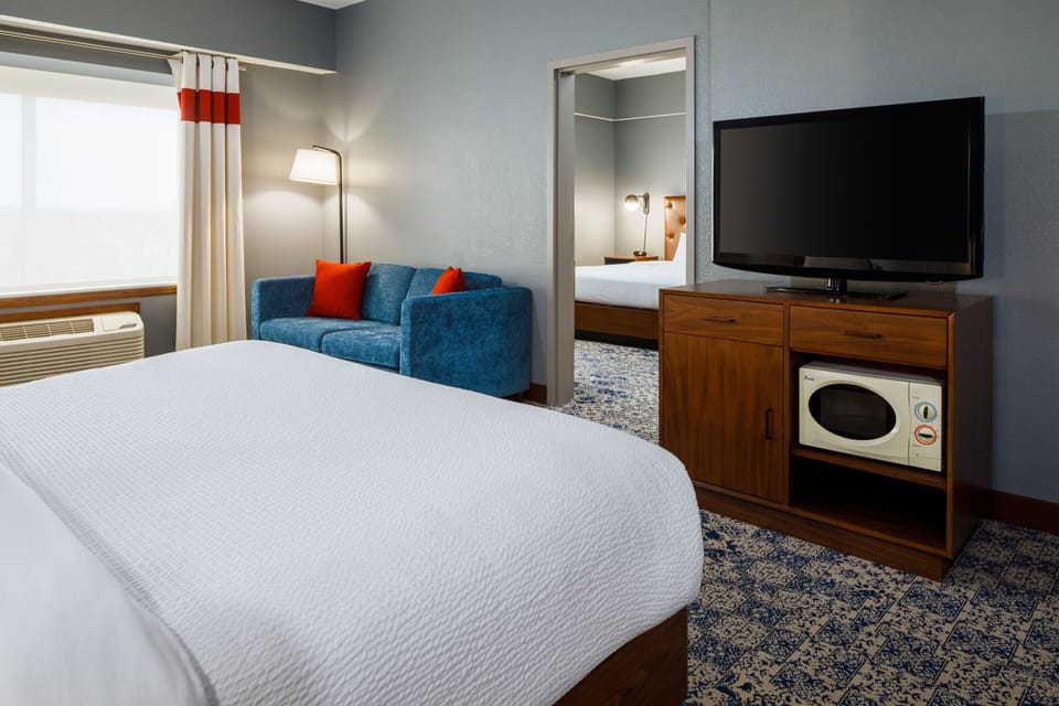 Hypo-allergenic bedding, down comforters, pillowtop beds, in-room safe