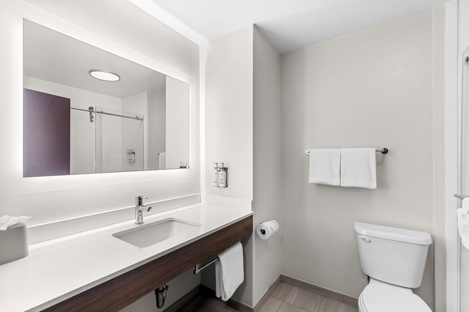 Combined shower/tub, hair dryer, towels, soap