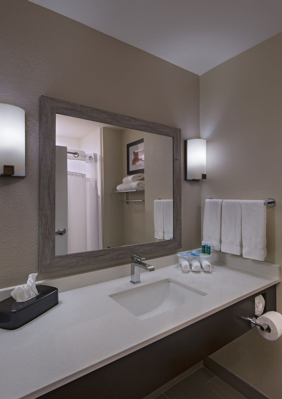Designer toiletries, hair dryer, towels, soap