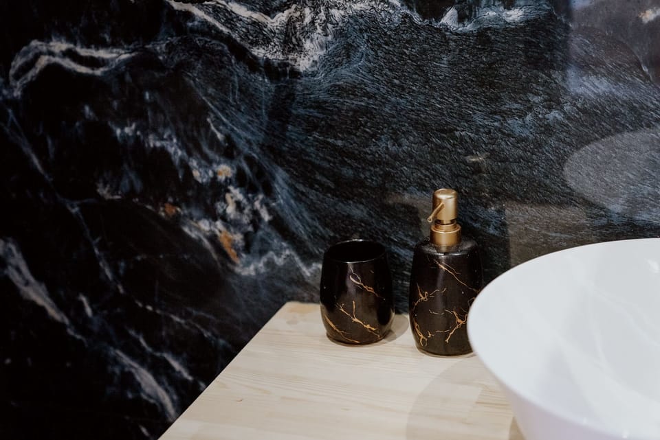 LUXURY ROOM 107 | Bathroom | Slippers, towels, soap, shampoo