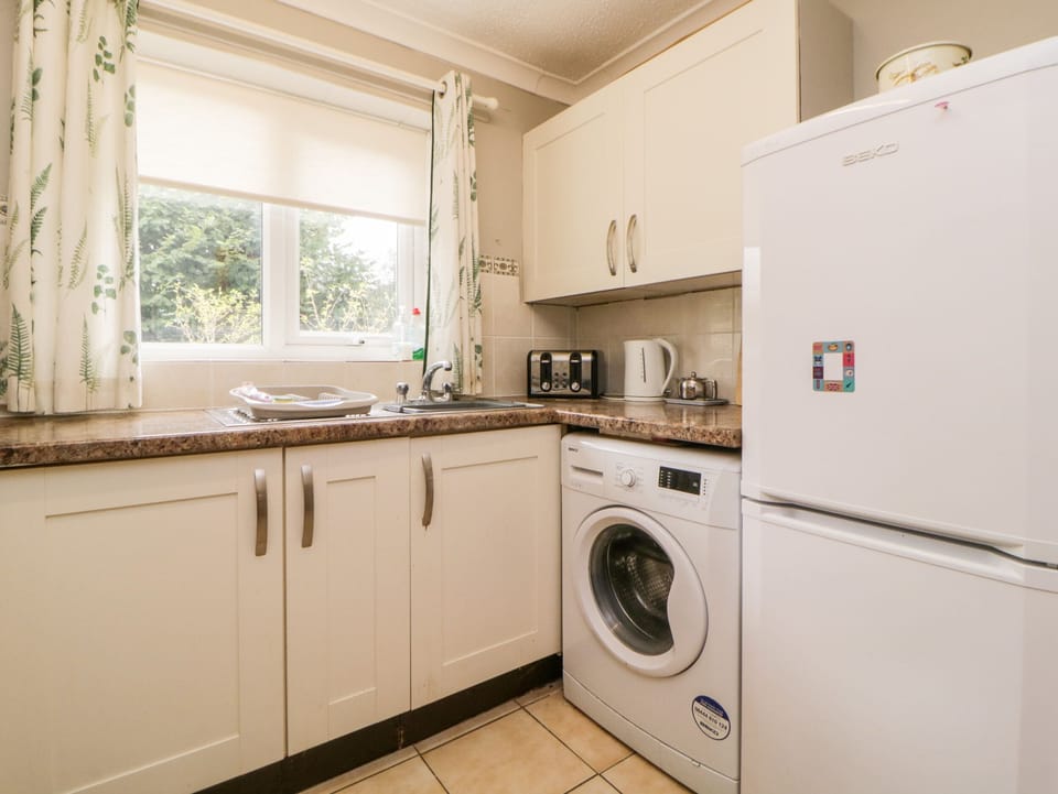 Fridge, electric kettle, toaster, cookware/dishes/utensils