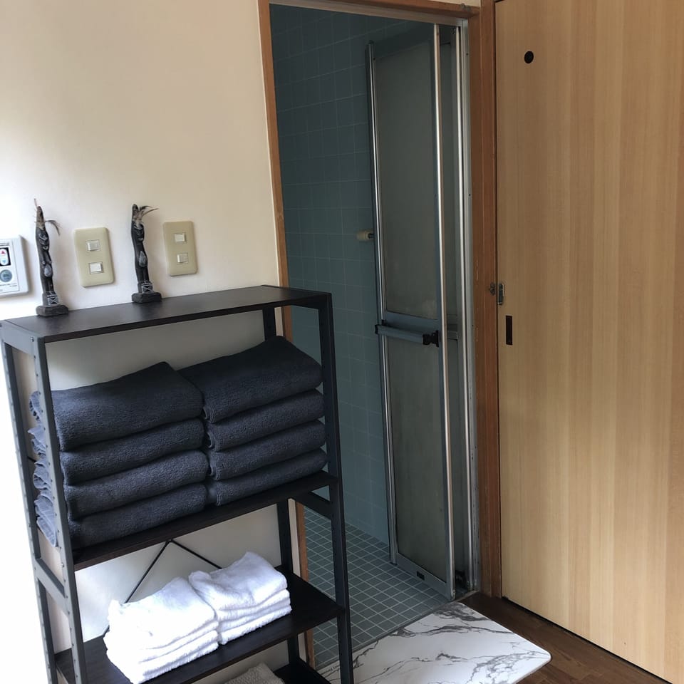 Separate tub and shower, free toiletries, hair dryer, slippers