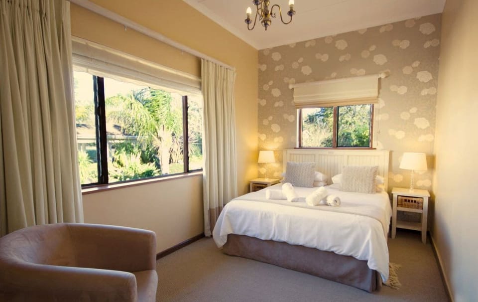 Luxury Suite, 1 Bedroom (Balcony Suite) | In-room safe, desk, laptop workspace, iron/ironing board