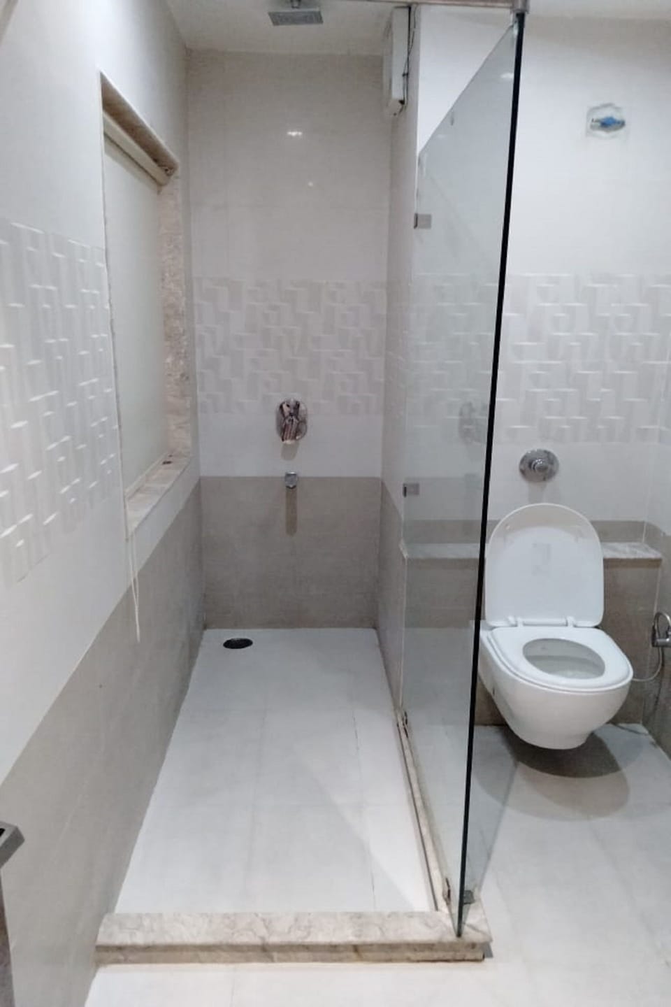 Shower, free toiletries, slippers, towels