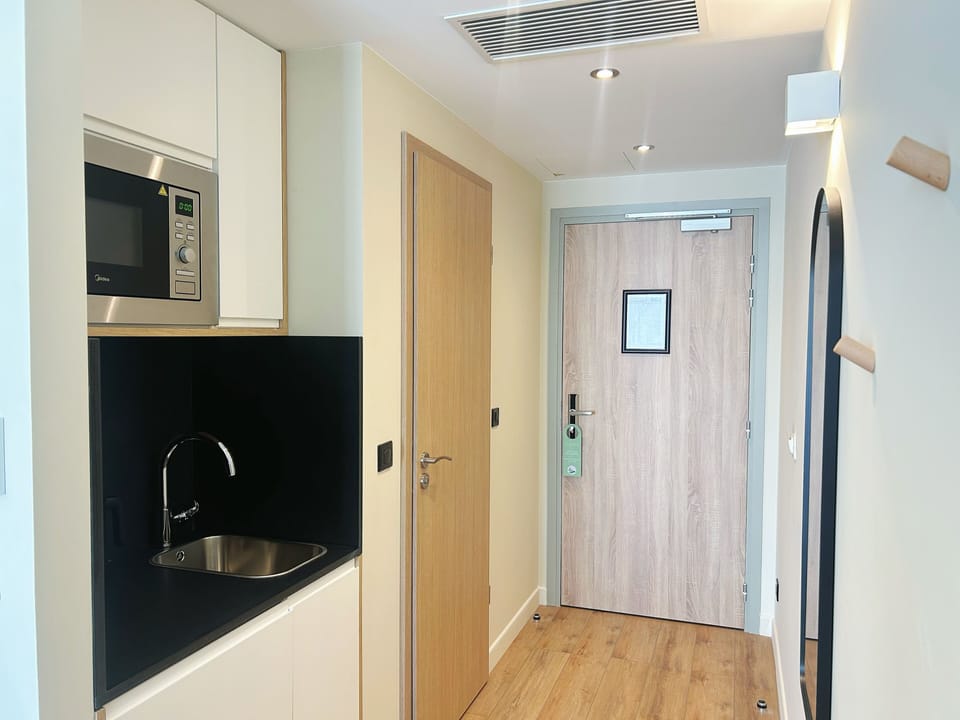 Standard Room, 2 Twin Beds, City View | In-room safe, desk, laptop workspace, blackout drapes