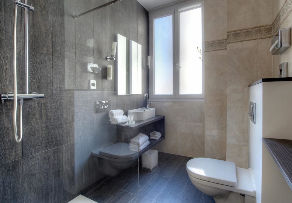Eco-friendly toiletries, hair dryer, slippers, towels