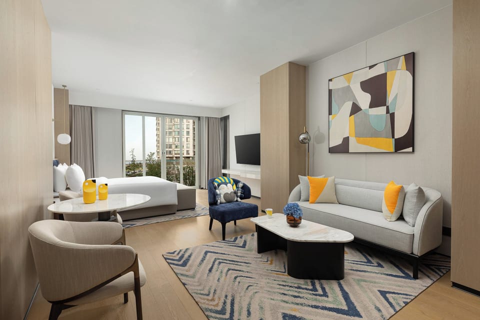 Suite, 1 King Bed | Minibar, in-room safe, blackout drapes, iron/ironing board